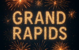 Bursting fireworks surrounding the words Grand Rapids in gold glitter lettering