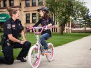 Cop Talking to a kid on a bike