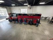 firemen in front of firetruck