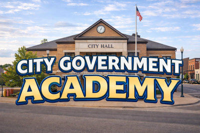 Picture of City Hall building with American Flag and words City Government Academy
